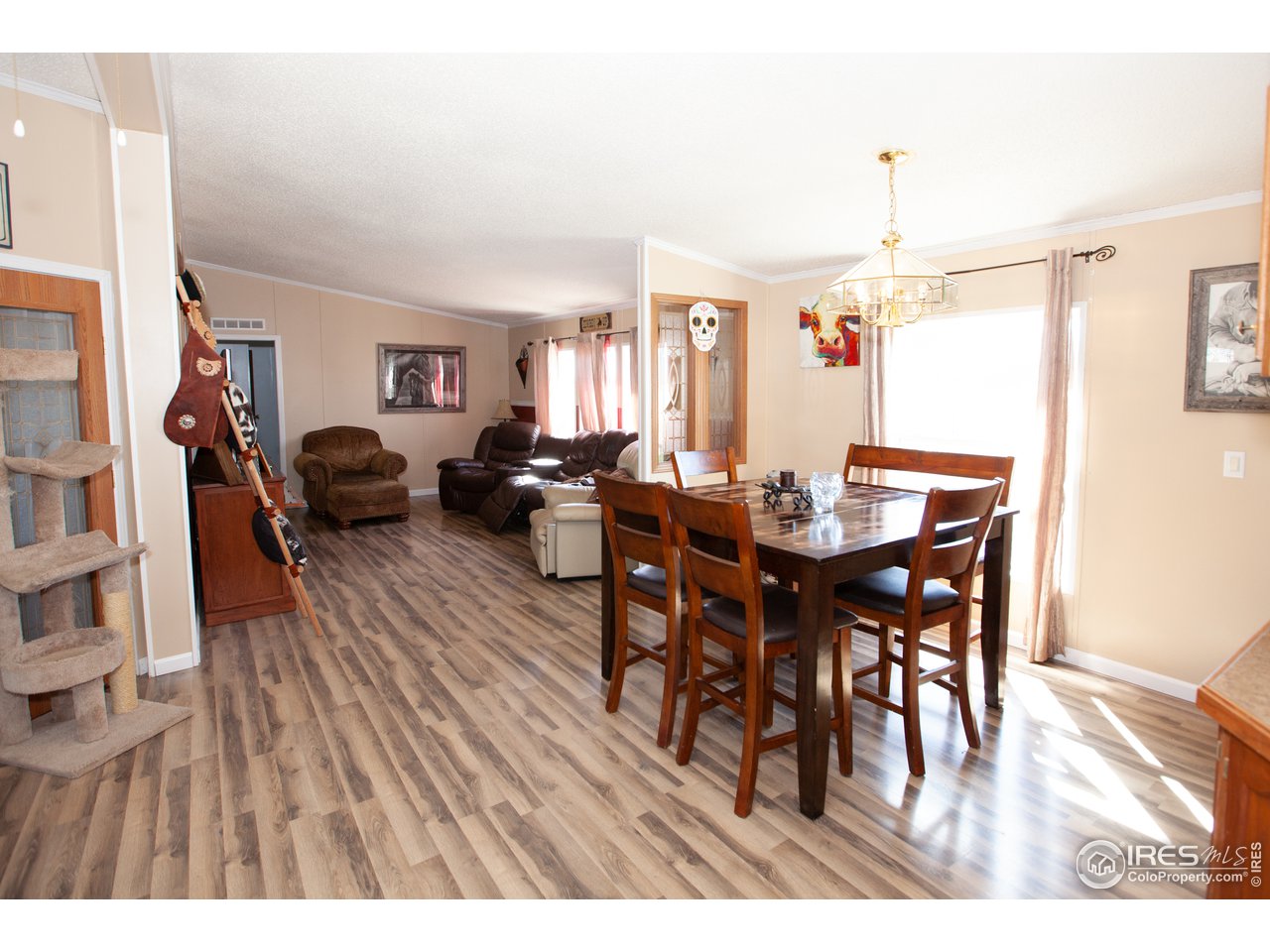14780 Bluestem Street Sterling, CO 80751 - Photo 13 of 40 a view of a dining room with furniture and wooden floor