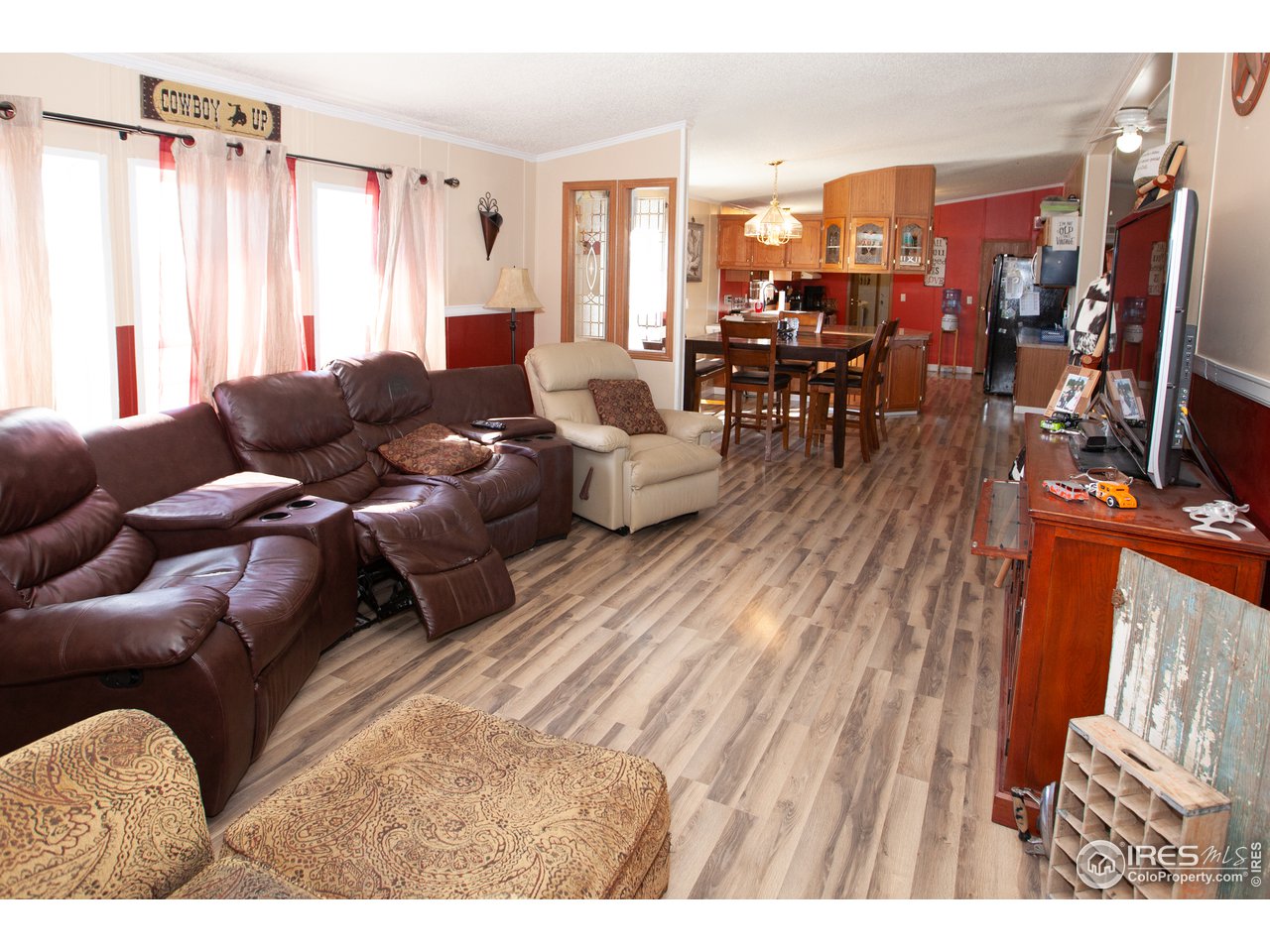 14780 Bluestem Street Sterling, CO 80751 - Photo 16 of 40 a living room with furniture and a large window