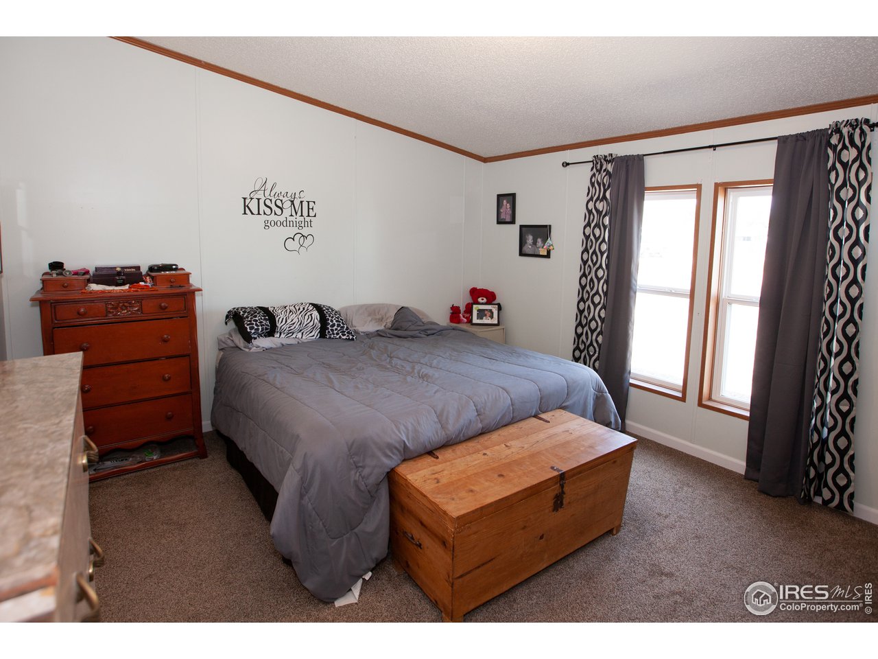 14780 Bluestem Street Sterling, CO 80751 - Photo 18 of 40 a living room with furniture and a window
