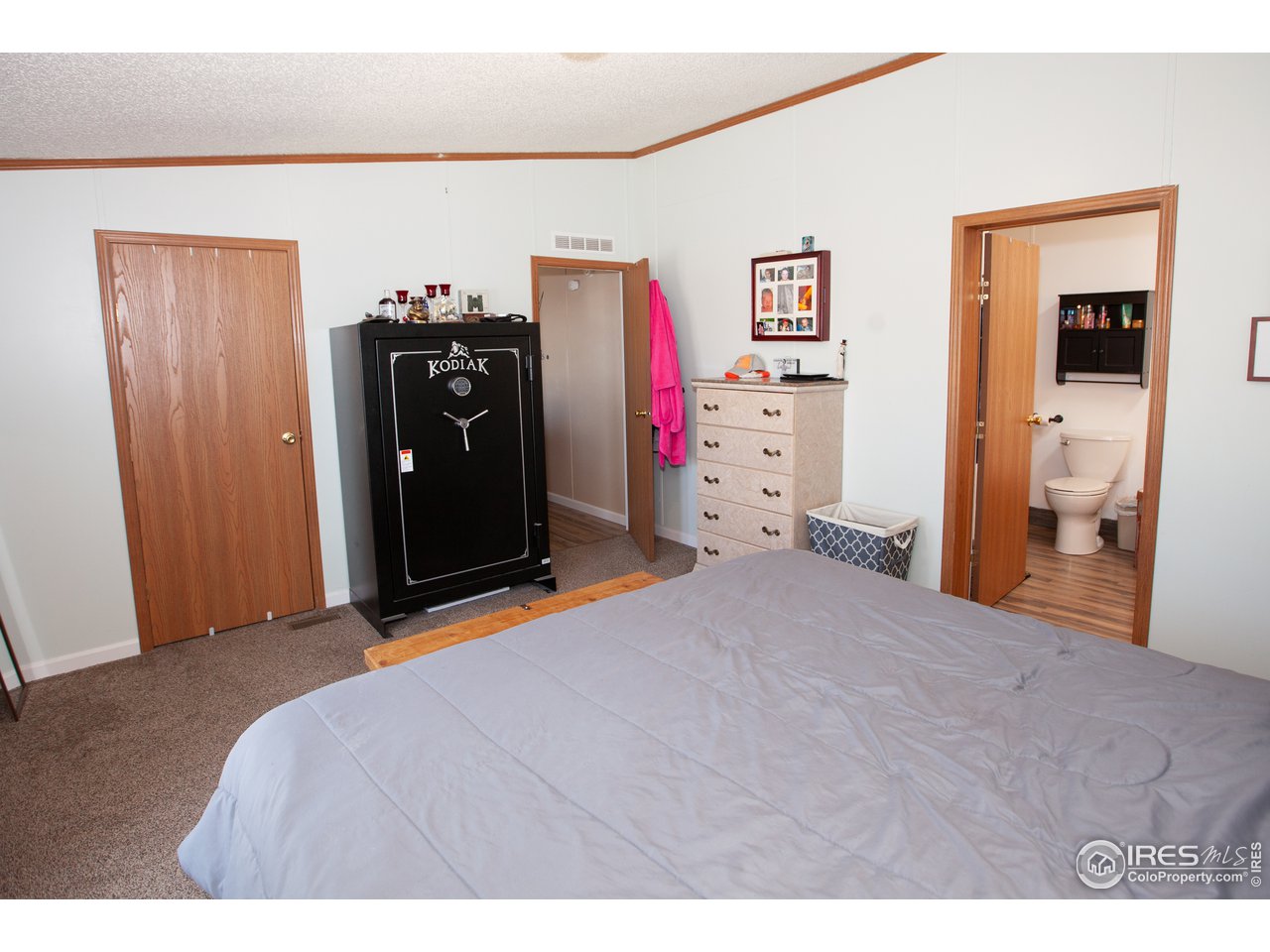 14780 Bluestem Street Sterling, CO 80751 - Photo 20 of 40 a bedroom with a bed and a closet