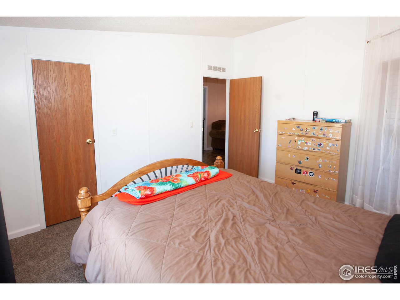 14780 Bluestem Street Sterling, CO 80751 - Photo 28 of 40 a bedroom with a bed and a closet