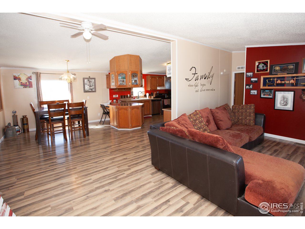 14780 Bluestem Street Sterling, CO 80751 - Photo 3 of 40 a living room with furniture and wooden floor
