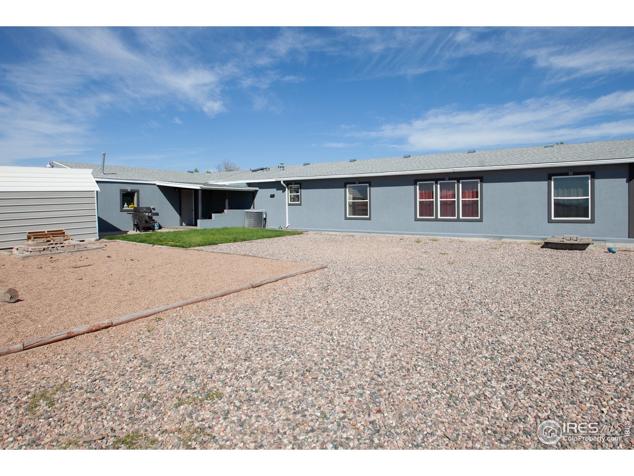 14780 Bluestem Street Sterling, CO 80751 - Photo 37 of 40 a house view with a backyard space