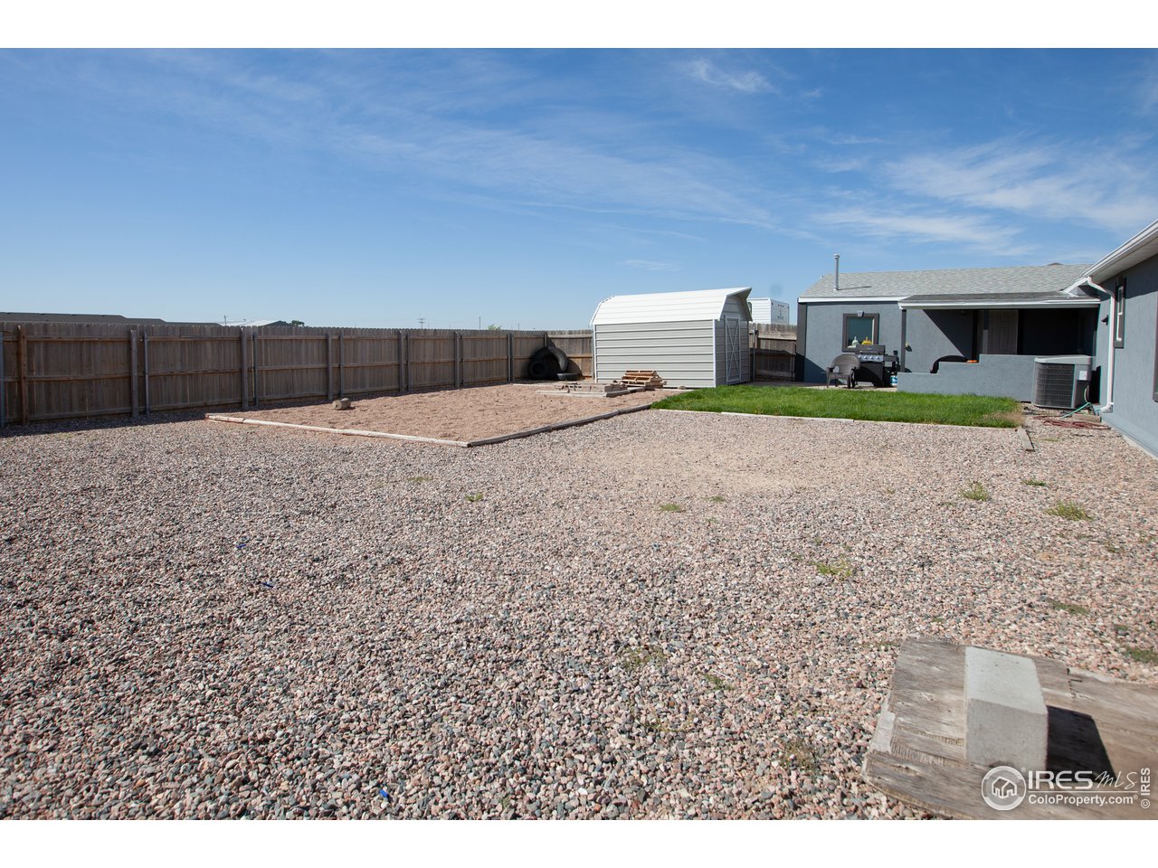 14780 Bluestem Street Sterling, CO 80751 - Photo 38 of 40 a living room with a couch and a table