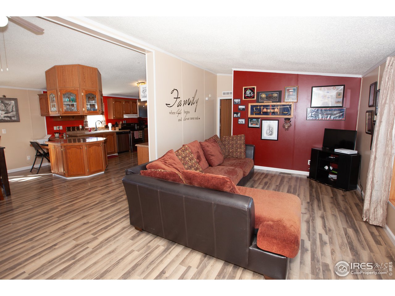14780 Bluestem Street Sterling, CO 80751 - Photo 4 of 40 a living room with furniture and a wooden floor