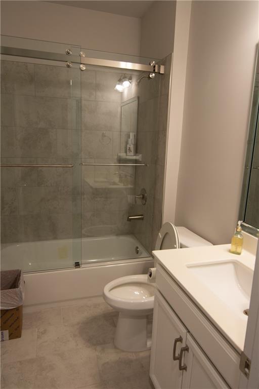 2472 Knob Crk Road Snellville, GA 30078 - Photo 17 of 30 a bathroom with a sink a toilet and a bathtub