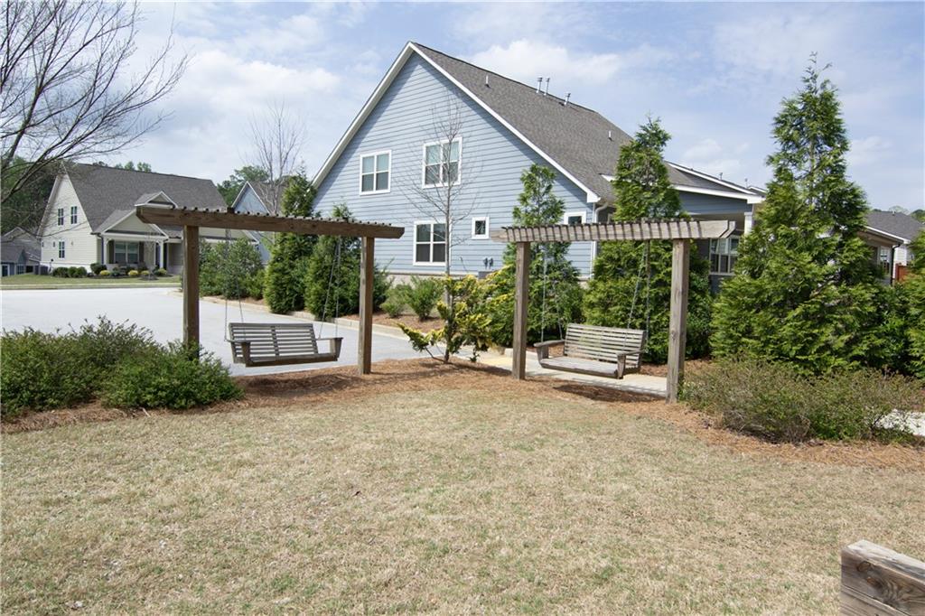 2472 Knob Crk Road Snellville, GA 30078 - Photo 24 of 30 a view of a house with backyard and porch