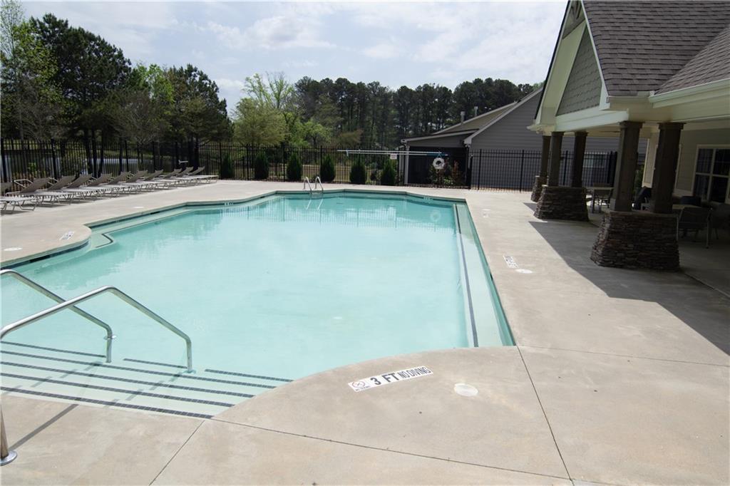 2472 Knob Crk Road Snellville, GA 30078 - Photo 25 of 30 a view of a swimming pool with a patio