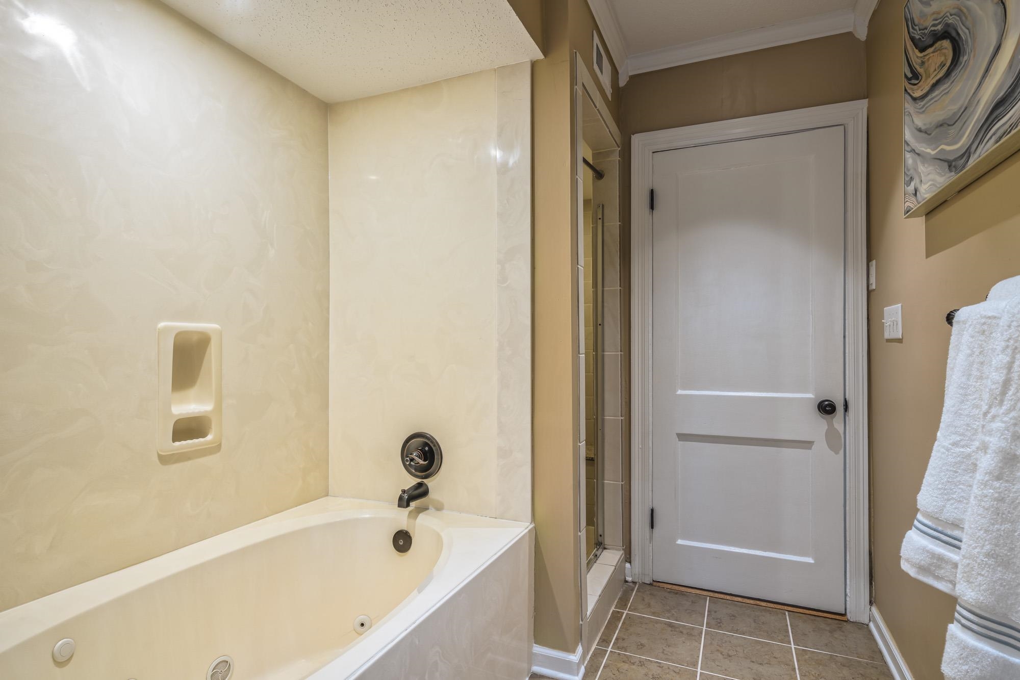 4518 Sequoia Road Memphis, TN 38117 - Photo 14 of 25 a bathroom with a bathtub and a shower