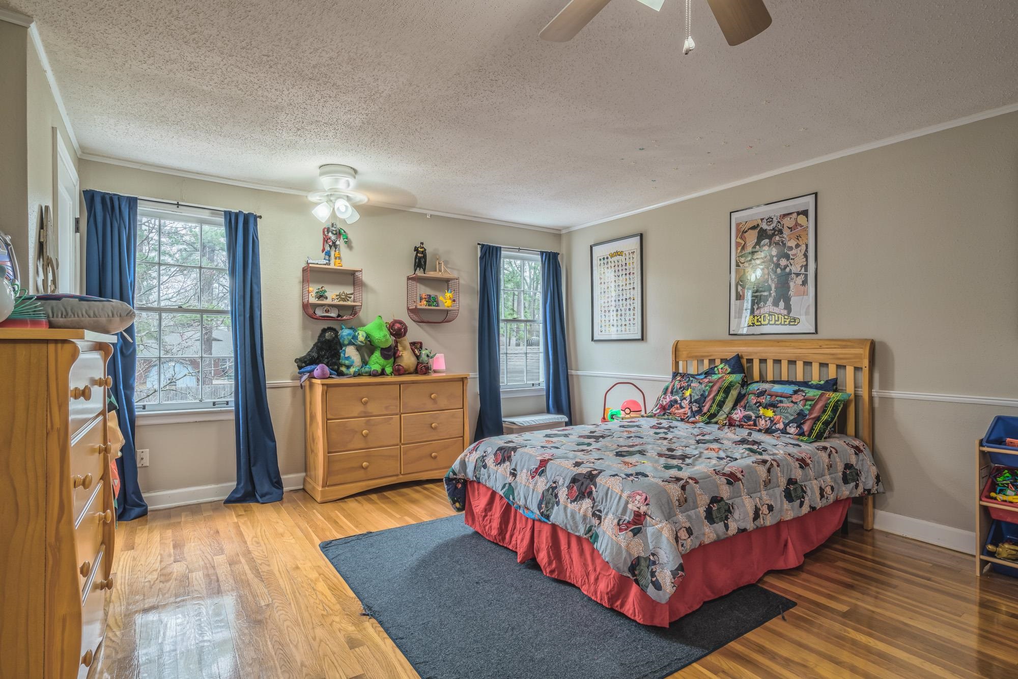 4518 Sequoia Road Memphis, TN 38117 - Photo 17 of 25 a bedroom with a bed and a dresser