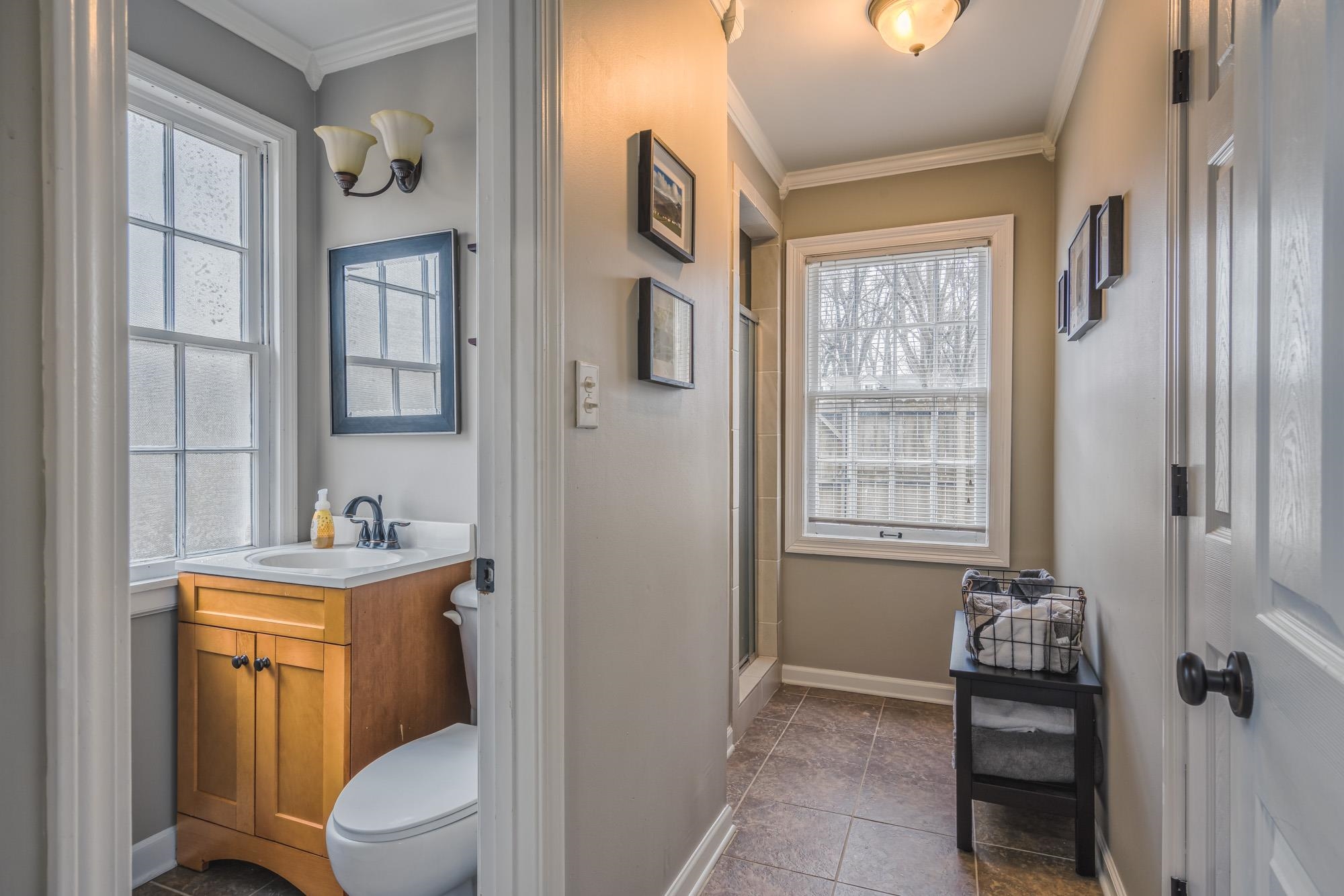 4518 Sequoia Road Memphis, TN 38117 - Photo 20 of 25 a bathroom with a toilet a sink and mirror