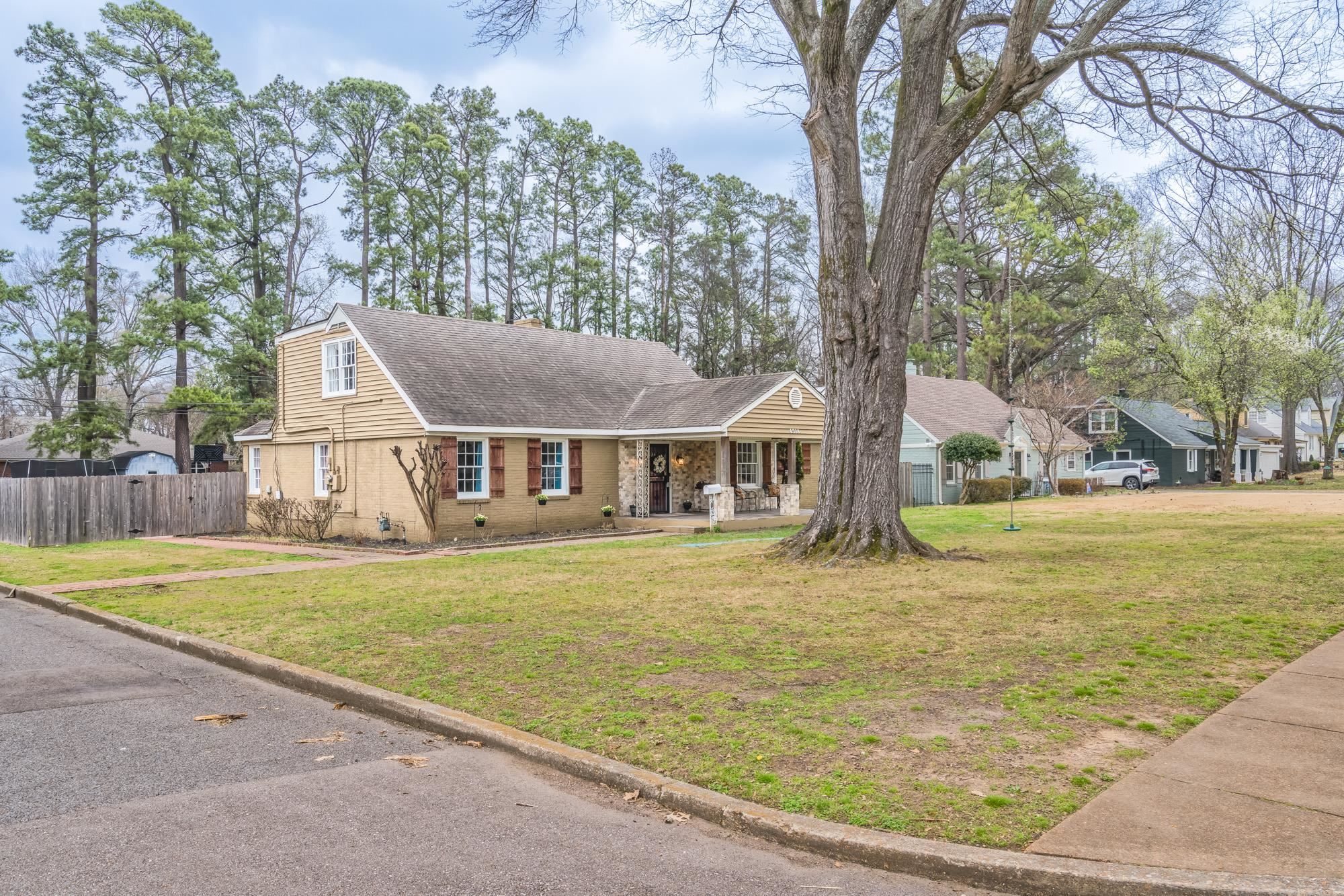 4518 Sequoia Road Memphis, TN 38117 - Photo 2 of 25 a front view of house with yard and trees