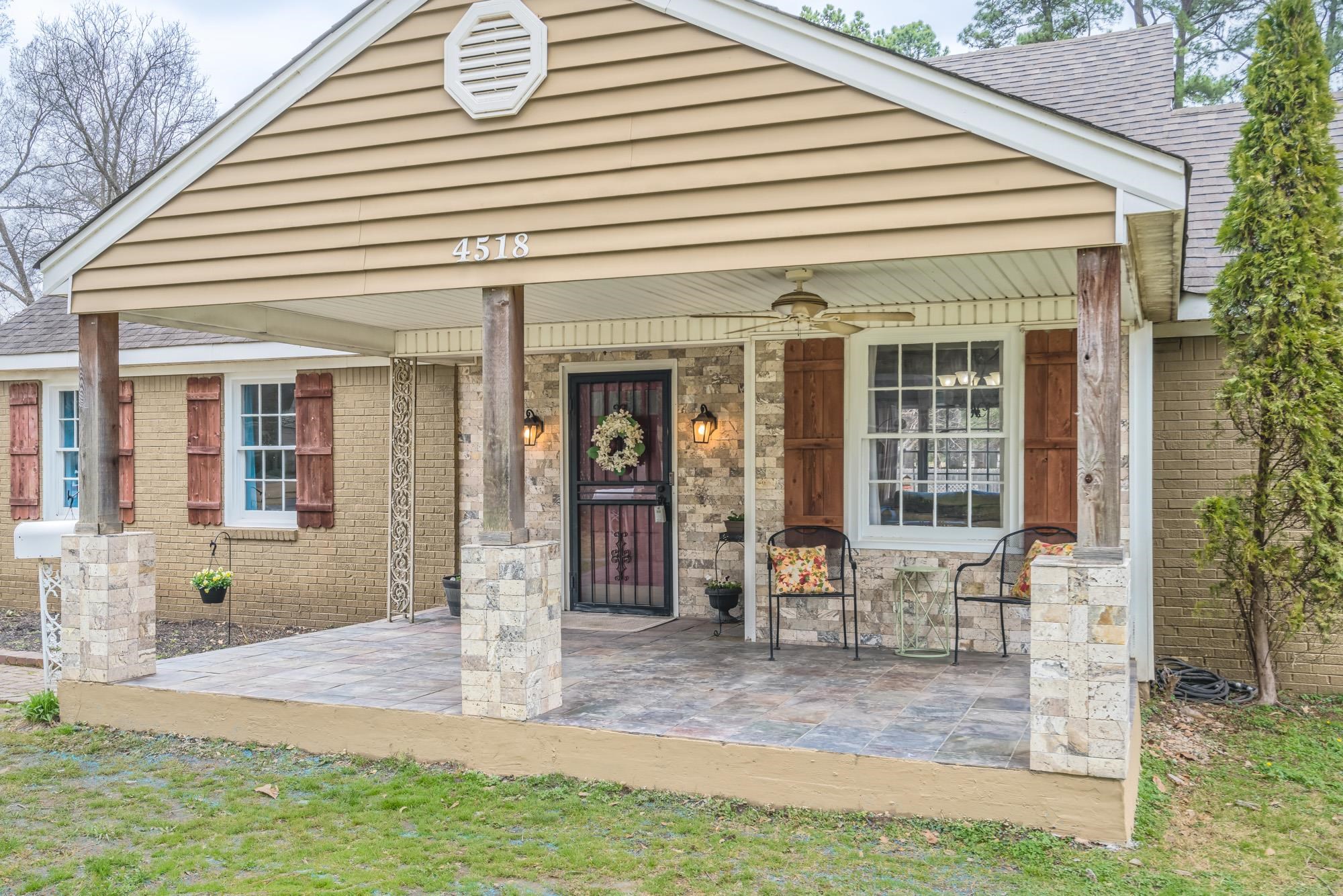 4518 Sequoia Road Memphis, TN 38117 - Photo 3 of 25 a front view of a house with garden
