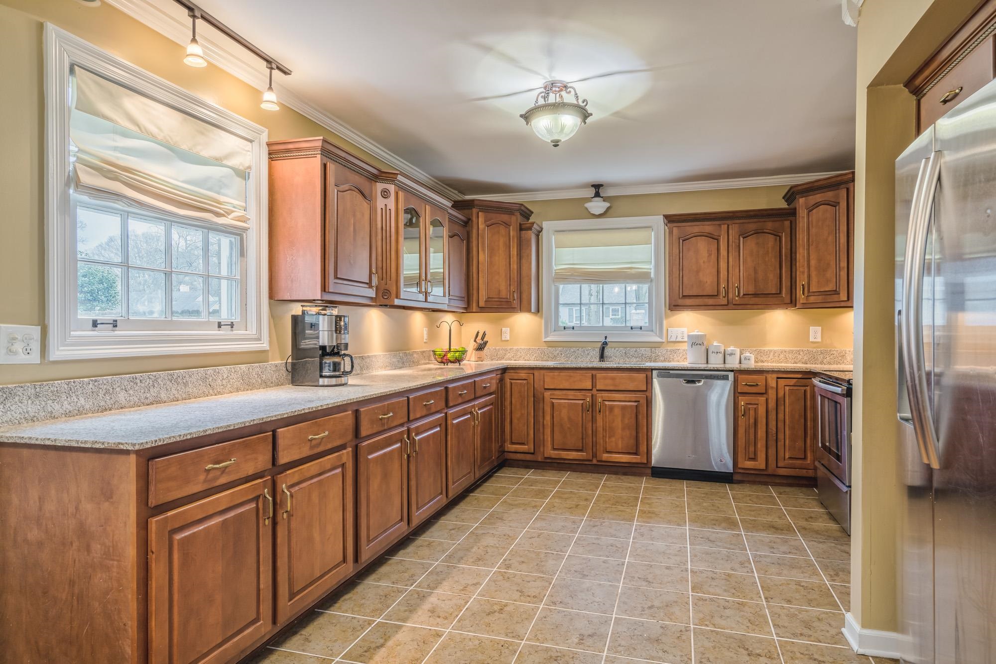 4518 Sequoia Road Memphis, TN 38117 - Photo 7 of 25 a kitchen with a sink a counter top space and appliances