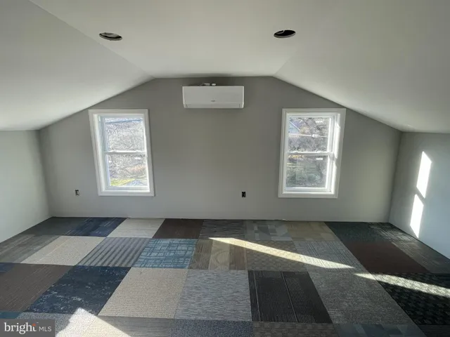 a view of house with backyard space and seating