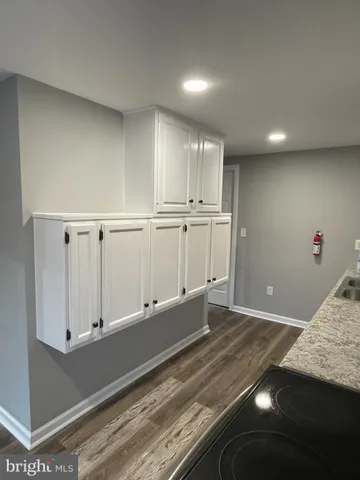 a view of kitchen and wooden floor