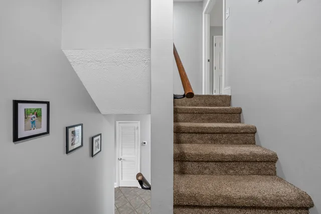 a view of staircase with white walls