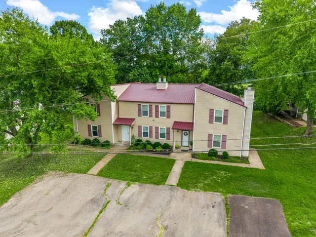 front view of a house with a yard