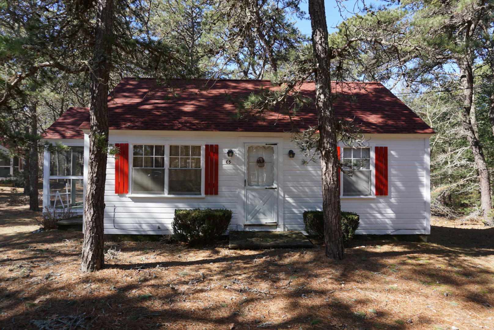 124 Castle Road, Unit 5 Truro, MA 02666 - Photo 1 of 22 a front view of a house with a yard