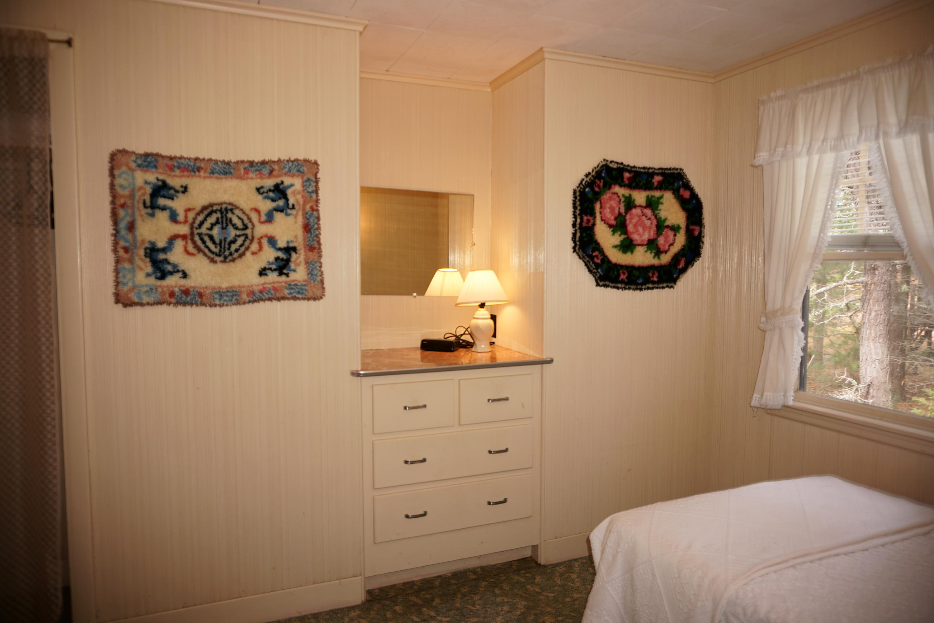 124 Castle Road, Unit 5 Truro, MA 02666 - Photo 18 of 22 a bedroom with a bed and wall painting