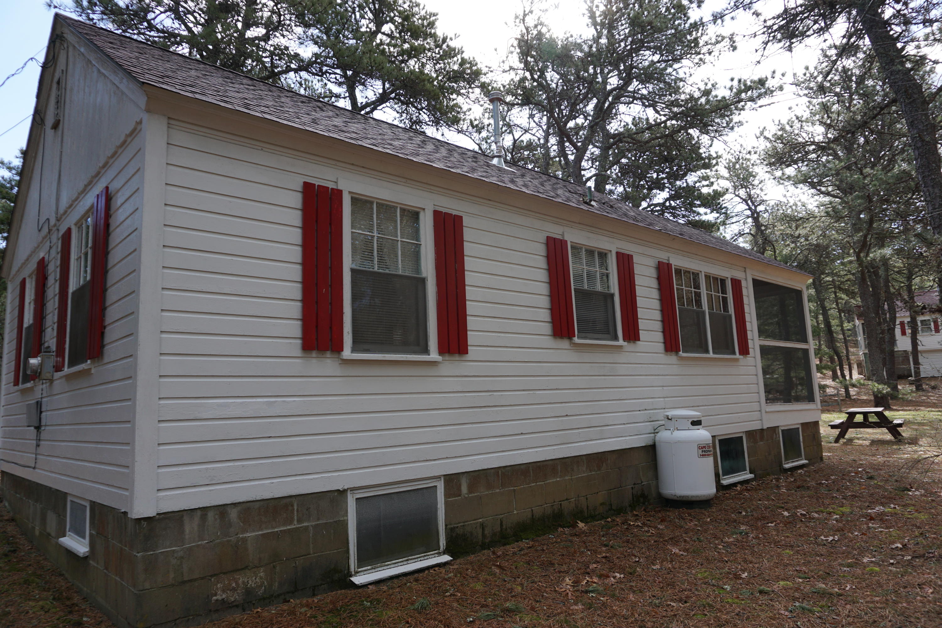 124 Castle Road, Unit 5 Truro, MA 02666 - Photo 3 of 22 a view of a house with a yard and wooden fence