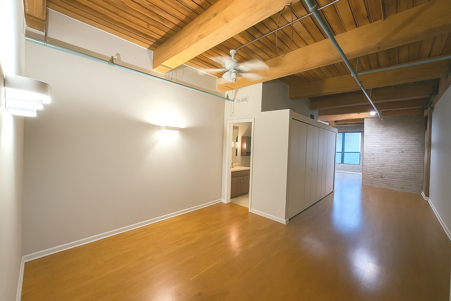 225 West Huron Street, Unit 403 Chicago, IL 60654 - Photo 2 of 9 a view of a room with wooden floor