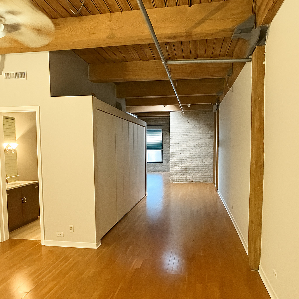 225 West Huron Street, Unit 403 Chicago, IL 60654 - Photo 4 of 9 a view of a hallway with wooden floor
