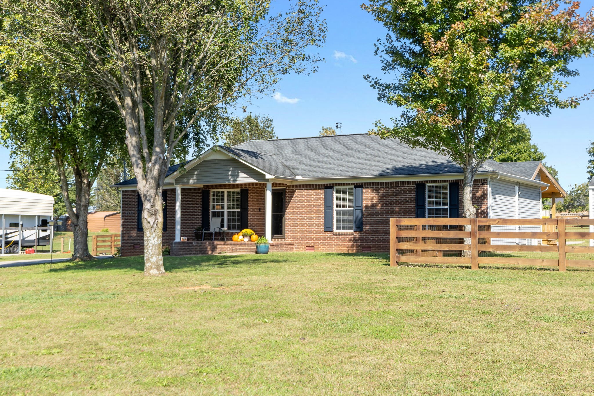 2118 Horton Way Lewisburg, TN 37091 - Photo 2 of 58 a front view of a house with a garden and trees