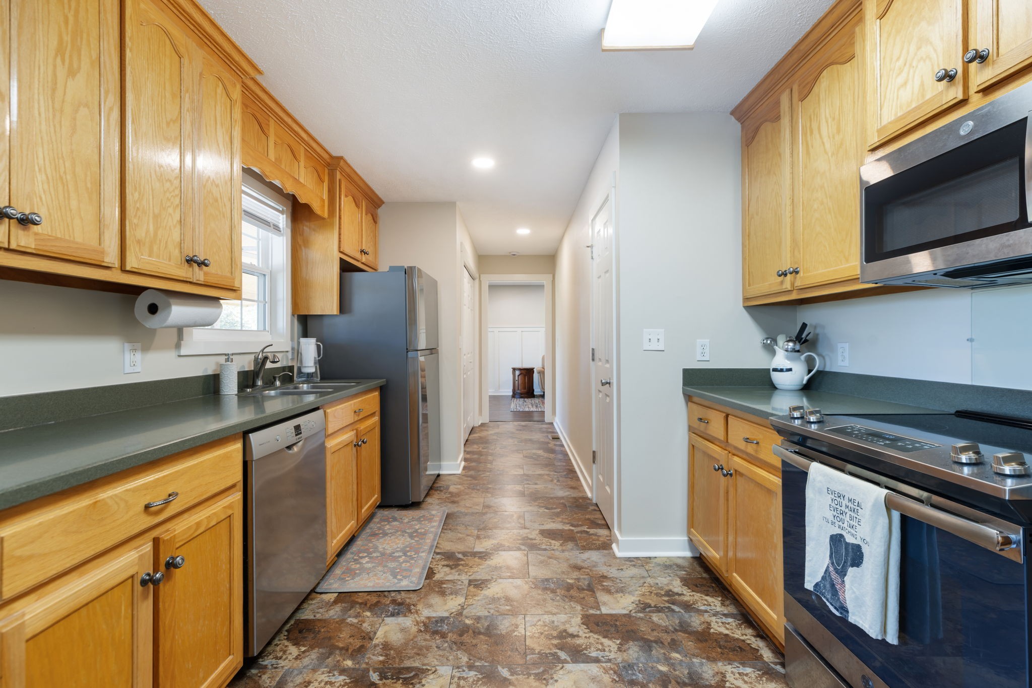 2118 Horton Way Lewisburg, TN 37091 - Photo 30 of 58 a kitchen with stainless steel appliances granite countertop a stove a sink and a microwave