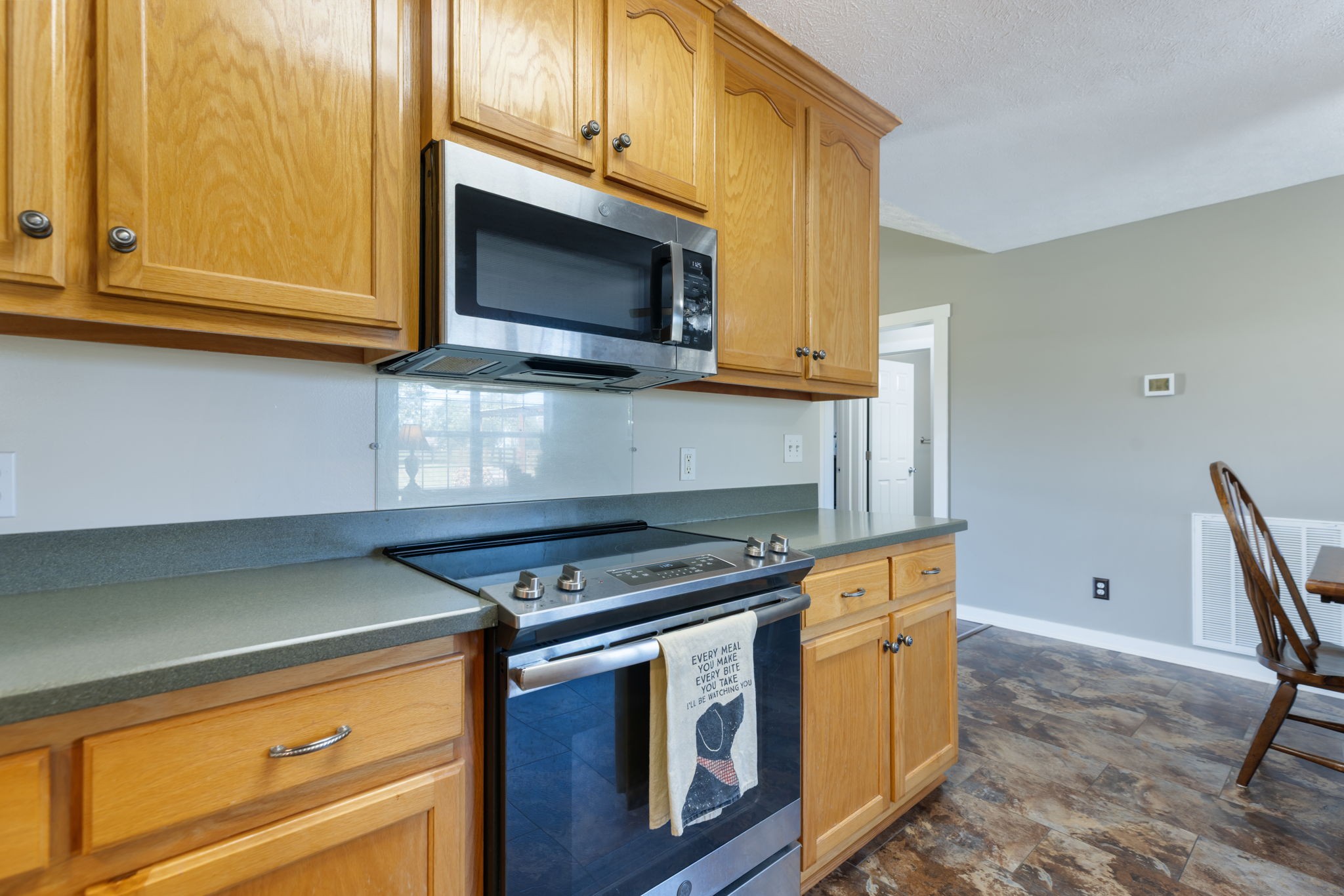 2118 Horton Way Lewisburg, TN 37091 - Photo 35 of 58 a kitchen with wooden cabinets and a stove top oven