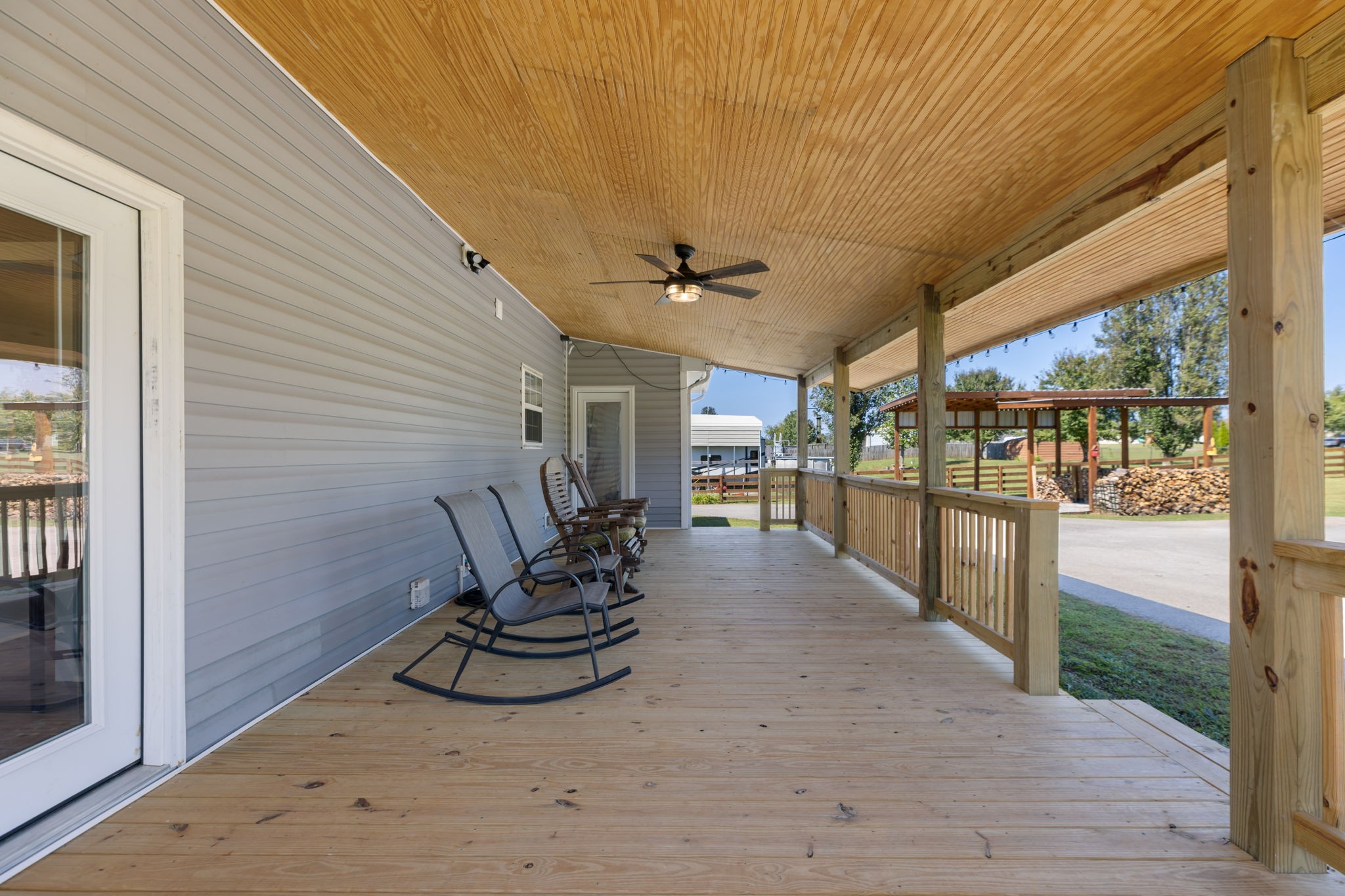 2118 Horton Way Lewisburg, TN 37091 - Photo 45 of 58 a view of a patio with table and chairs with wooden floor and fence