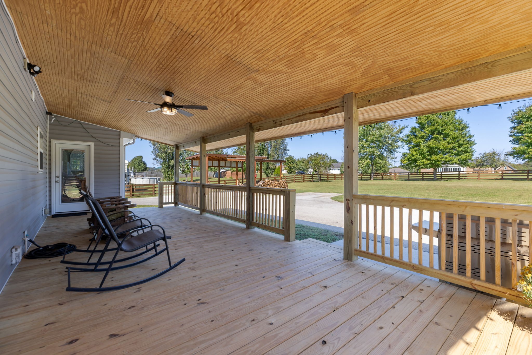 2118 Horton Way Lewisburg, TN 37091 - Photo 46 of 58 a view of a patio with table and chairs with wooden floor and fence