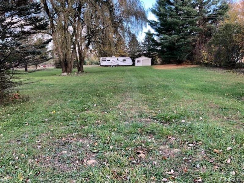 3961 Washburn Road Vassar, MI 48768 - Photo 3 of 25 To the south side is a cement slab that had a mobile home in the past and still has the 2nd septic & field & a garage with opener.