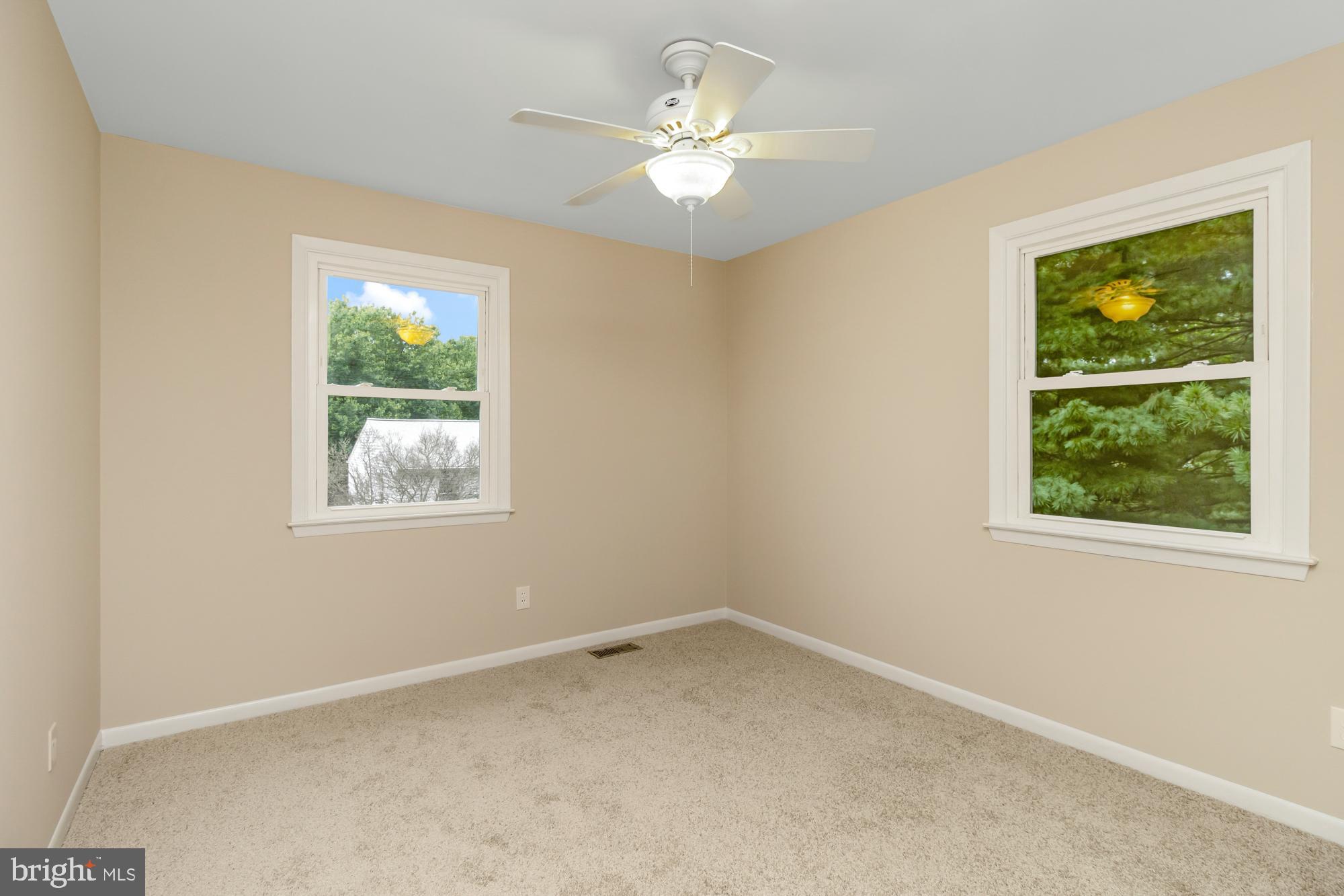 3640 Rockberry Road Baltimore, MD 21234 - Photo 20 of 37 an empty room with windows and ceiling fan