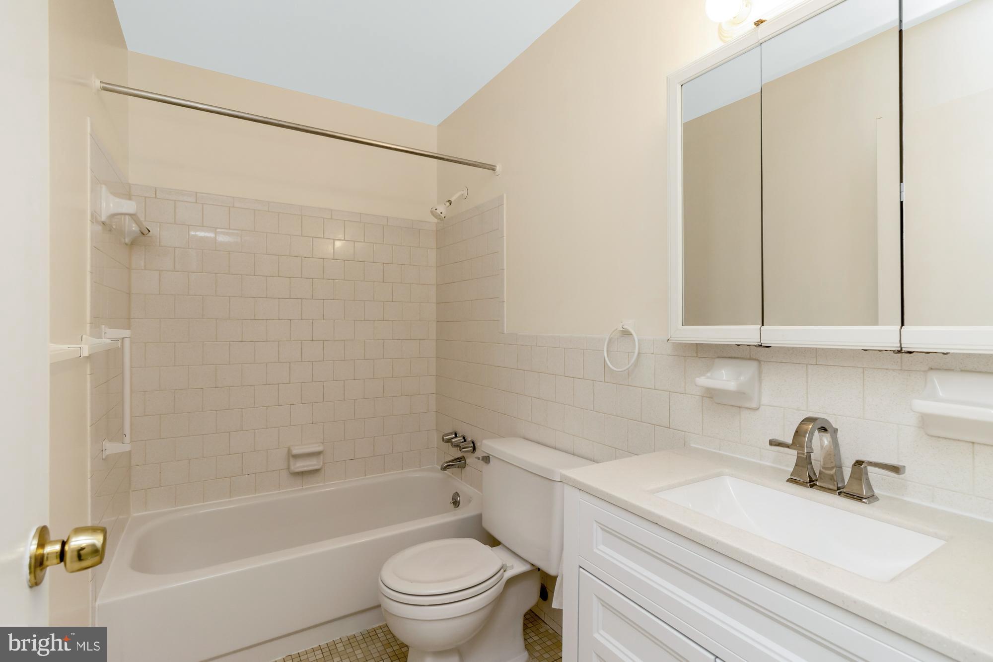 3640 Rockberry Road Baltimore, MD 21234 - Photo 24 of 37 a bathroom with a granite countertop bathtub shower sink vanity and toilet