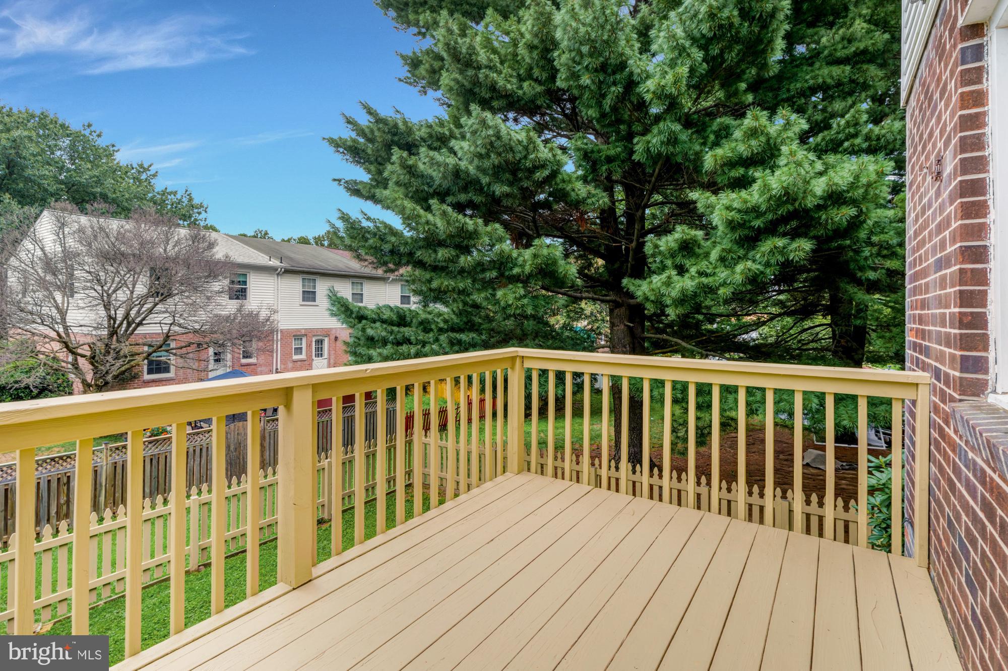 3640 Rockberry Road Baltimore, MD 21234 - Photo 31 of 37 a balcony with wooden floor and fence