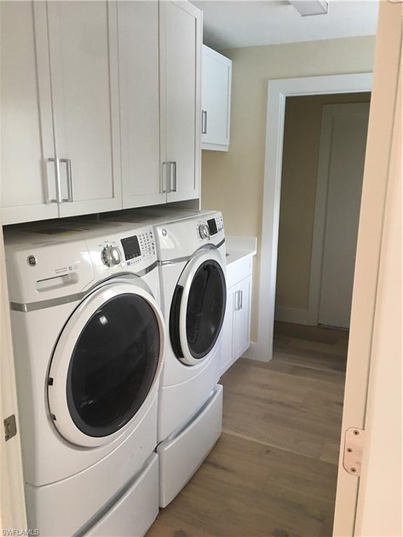 1300 Dolphin Road Naples, FL 34102 - Photo 16 of 22 a utility room with dryer and washer