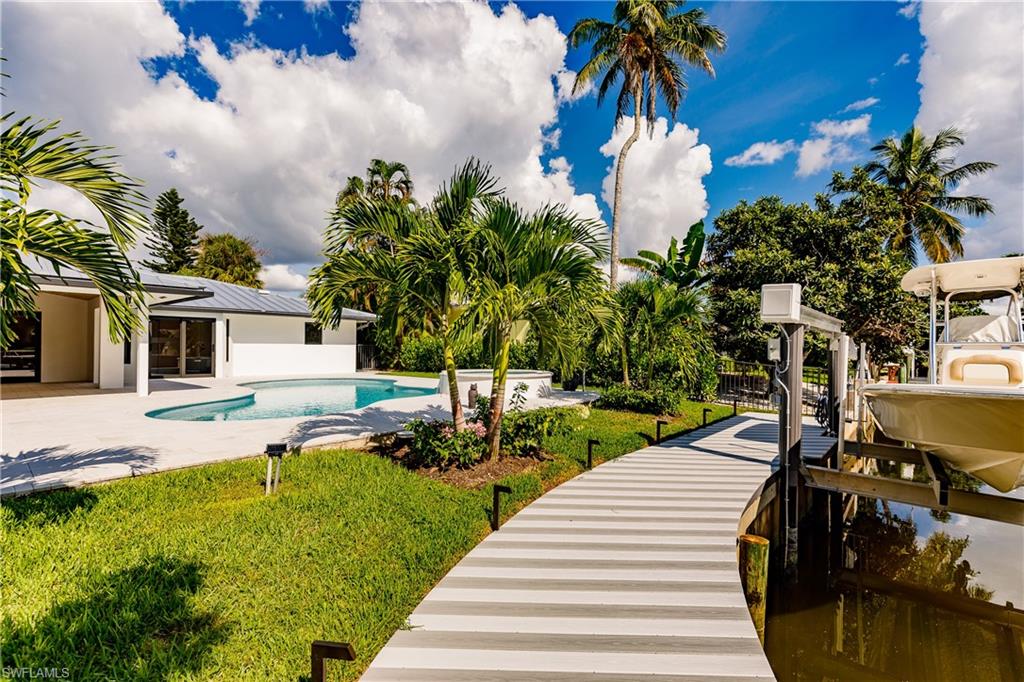 1300 Dolphin Road Naples, FL 34102 - Photo 19 of 22 a view of a backyard