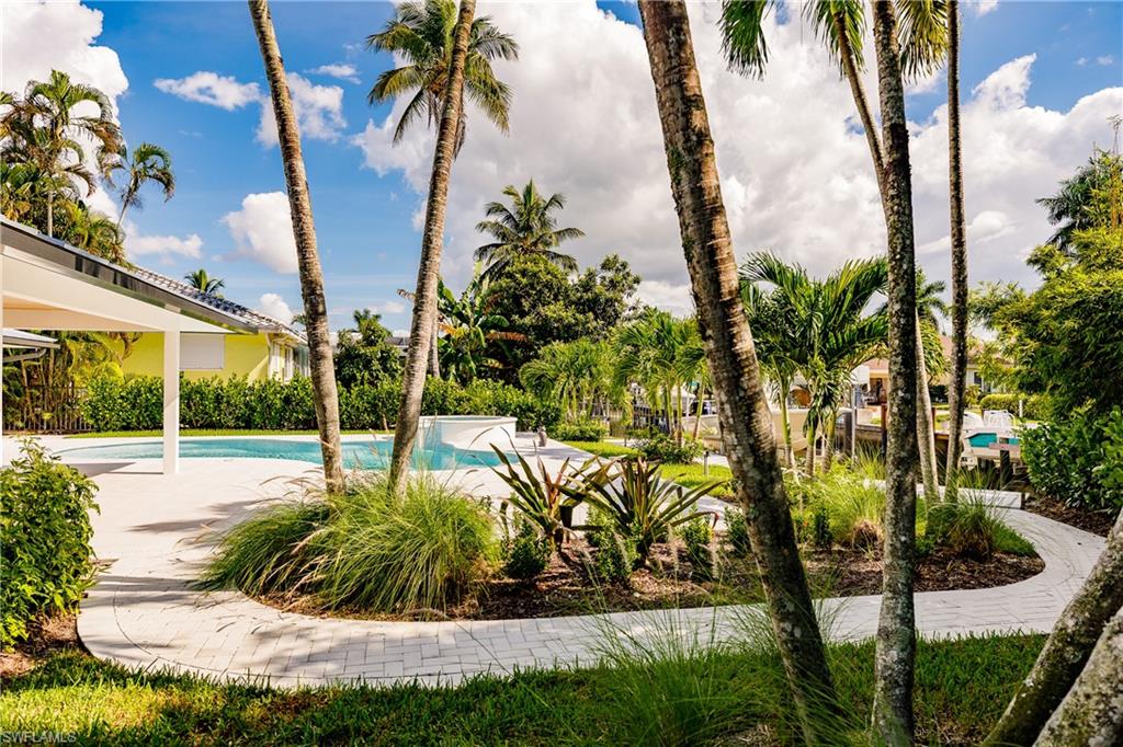1300 Dolphin Road Naples, FL 34102 - Photo 20 of 22 a view of a backyard