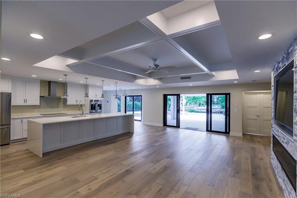 1300 Dolphin Road Naples, FL 34102 - Photo 22 of 22 a large kitchen with a lot of counter space and a wooden floor
