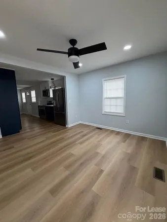 a view of an empty room with a window