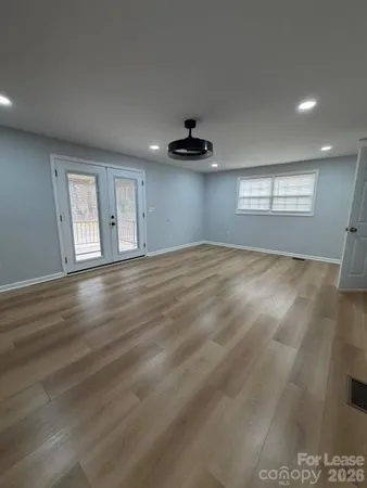 a view of an empty room with a window