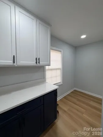 a kitchen with a sink cabinets and a window