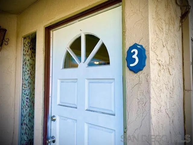 a painting on a wall next to a door