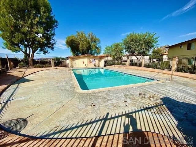 a view of a backyard of the house