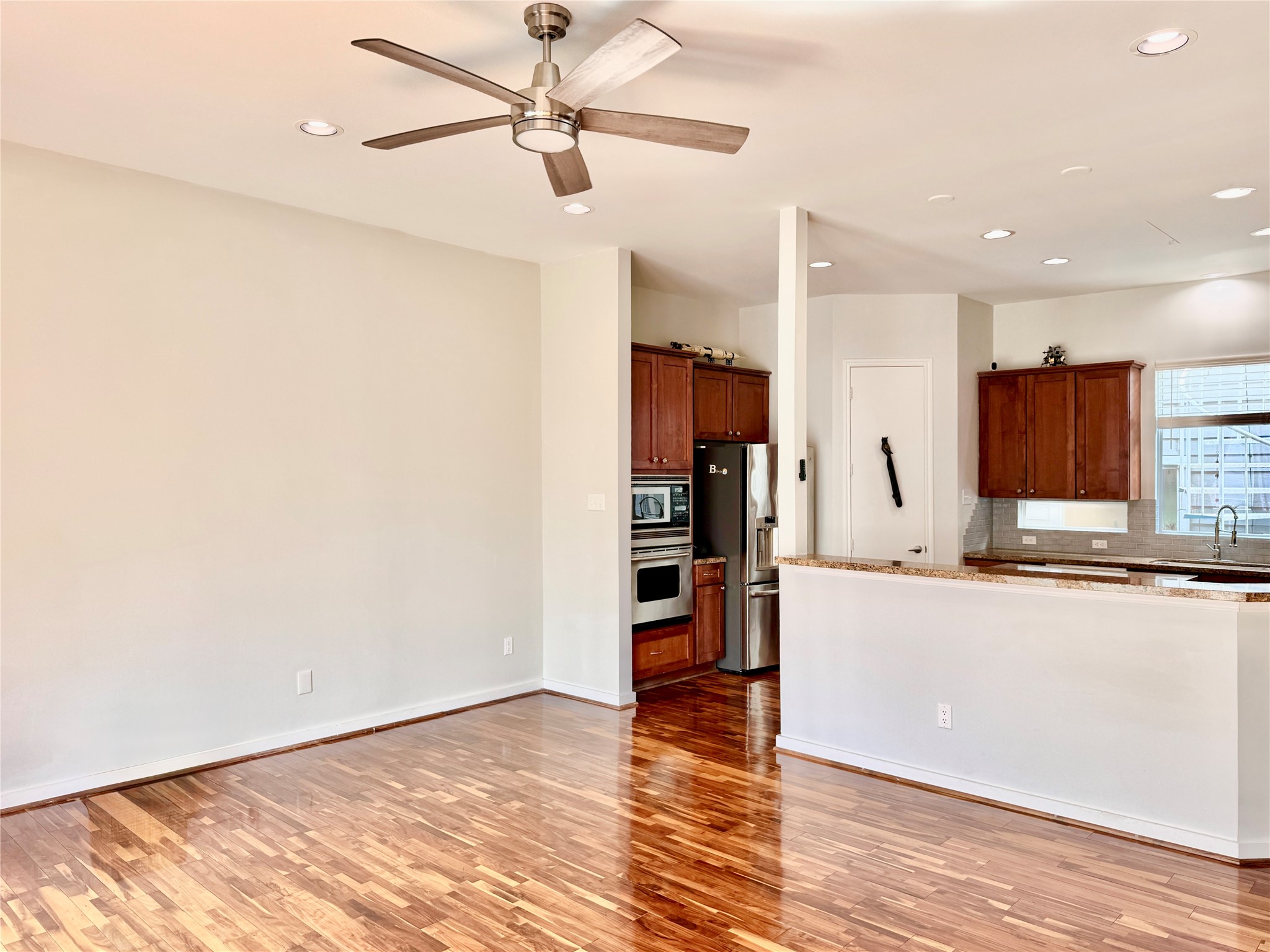 608 West Drew Street, Unit B Houston, TX 77006 - Photo 14 of 42 a kitchen with stainless steel appliances a refrigerator and a stove top oven