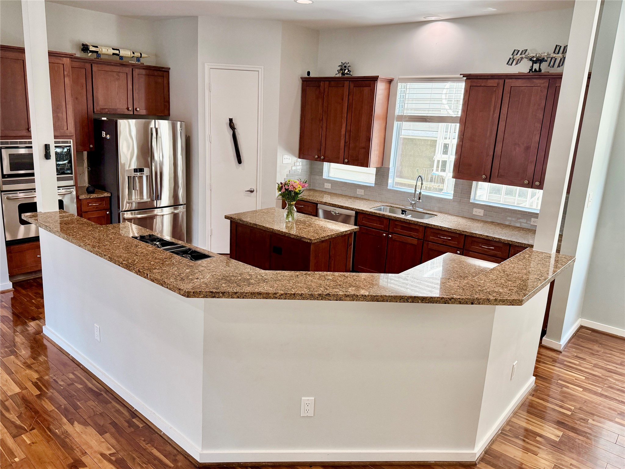 608 West Drew Street, Unit B Houston, TX 77006 - Photo 16 of 42 a kitchen with granite countertop a sink and a refrigerator