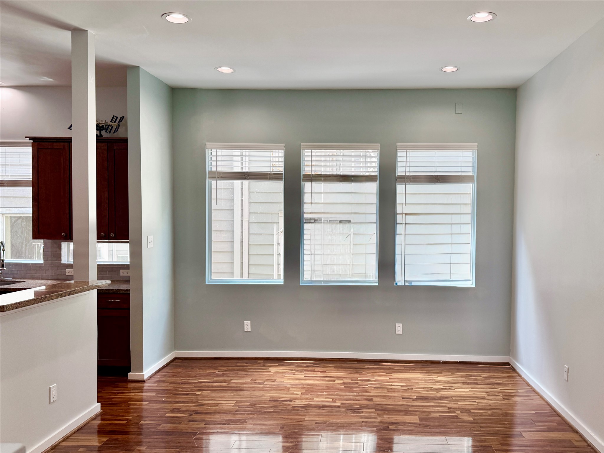 608 West Drew Street, Unit B Houston, TX 77006 - Photo 21 of 42 an empty room with wooden floor and windows