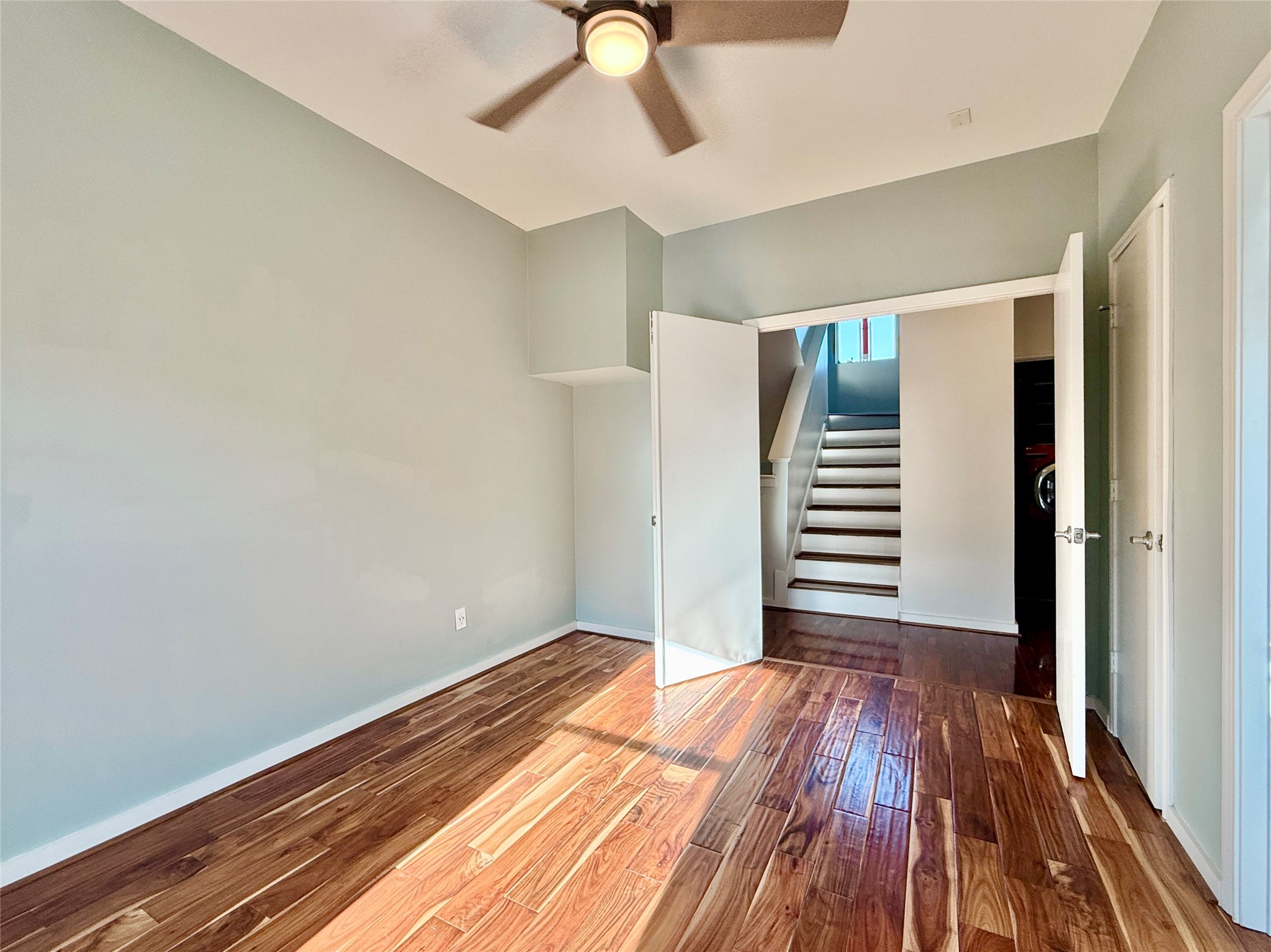 608 West Drew Street, Unit B Houston, TX 77006 - Photo 23 of 42 a view of a room with wooden floor and white walls