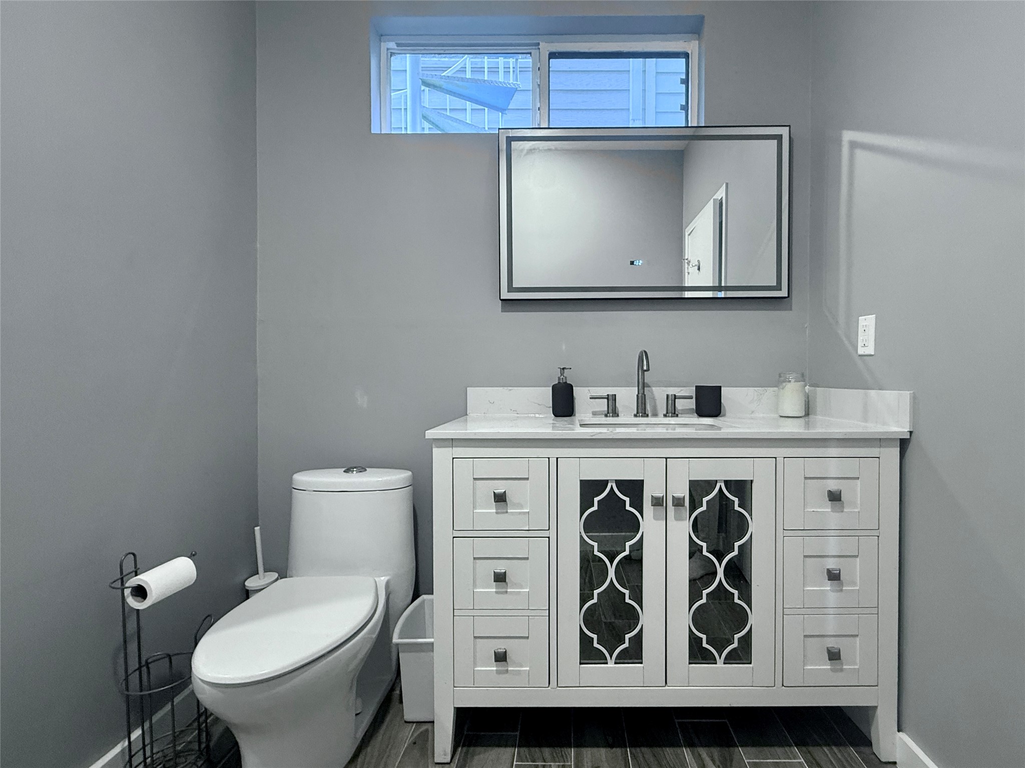 608 West Drew Street, Unit B Houston, TX 77006 - Photo 3 of 42 a bathroom with a toilet sink and mirror